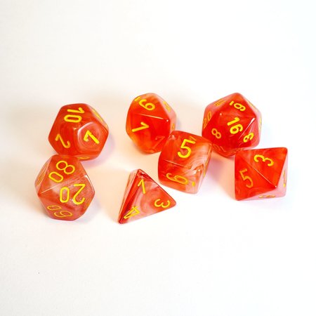 Image of Chessex Ghostly Glow - Orange/Yellow - 7 Dice